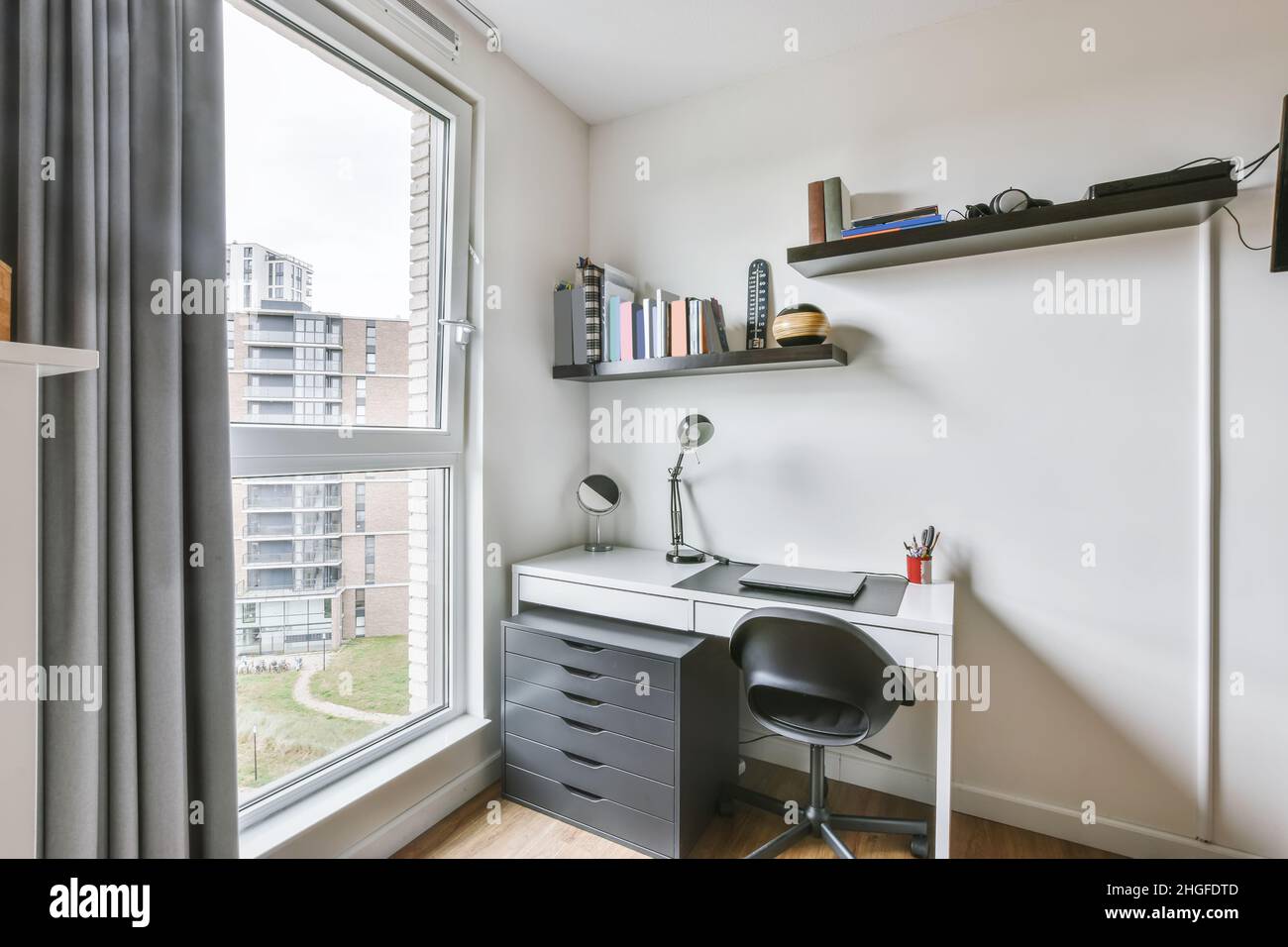 Stylish minimalist workroom with wooden parquet floor Stock Photo Alamy