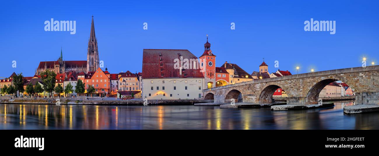 Panorama of the Stone Bridge, St. Peter's Church and the Old Town of Regensburg in Germany Stock Photo