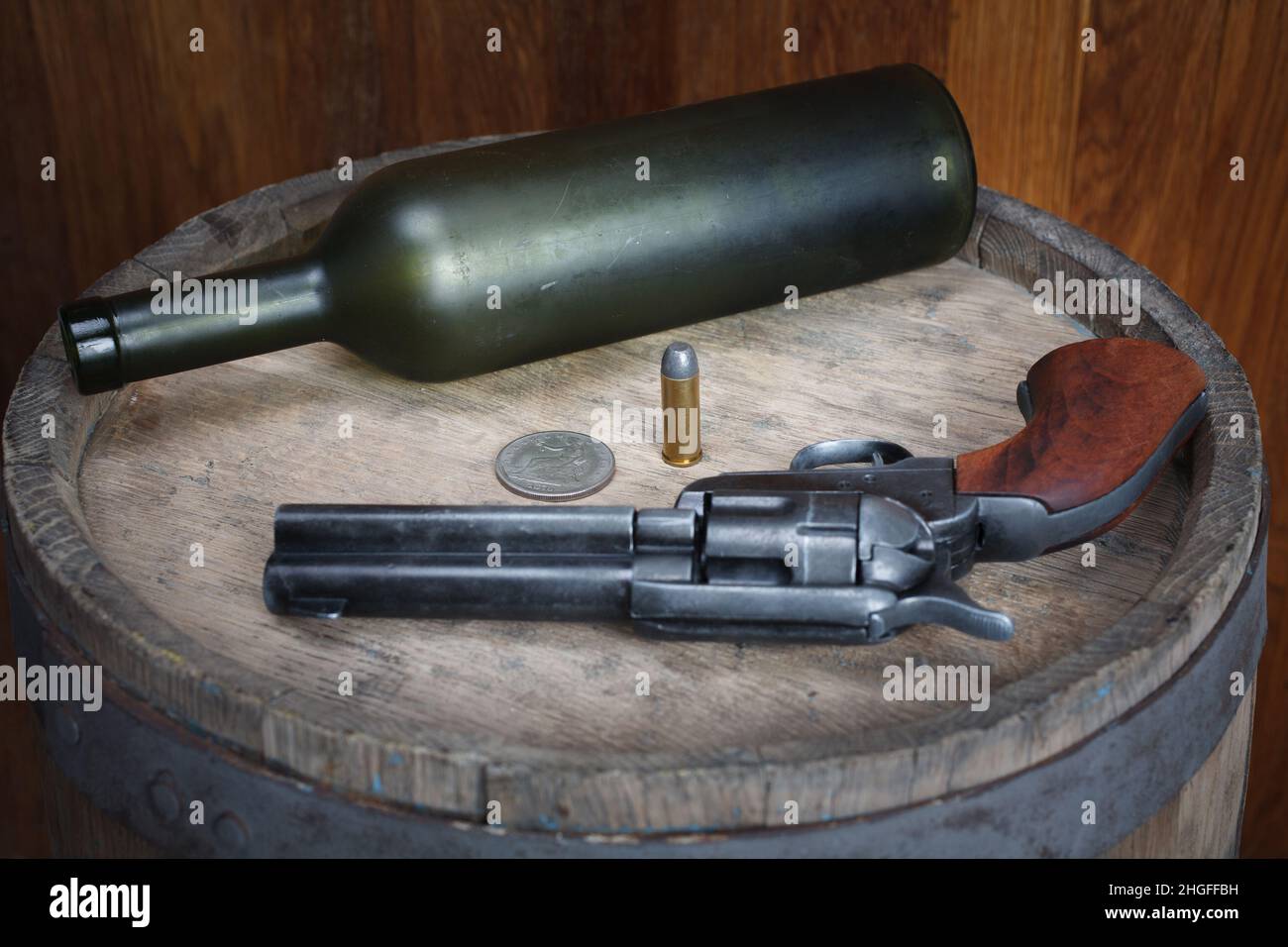 Old west revolver with cartridges on wooden barrel Stock Photo Alamy