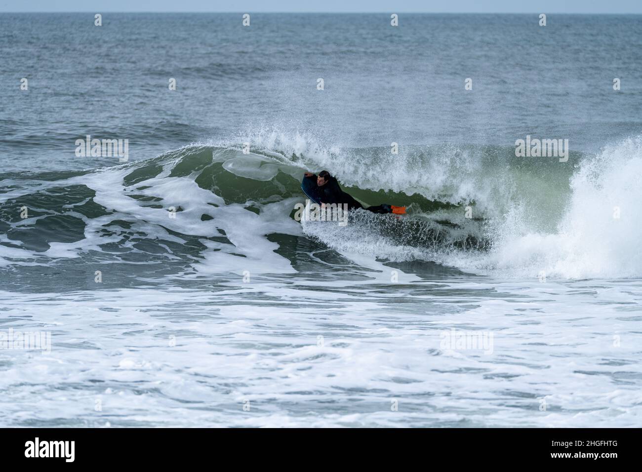 Ocean Wave Trick Roping Bodyboarder performing a tube trick surfing ocean wavesurfing ocean ...