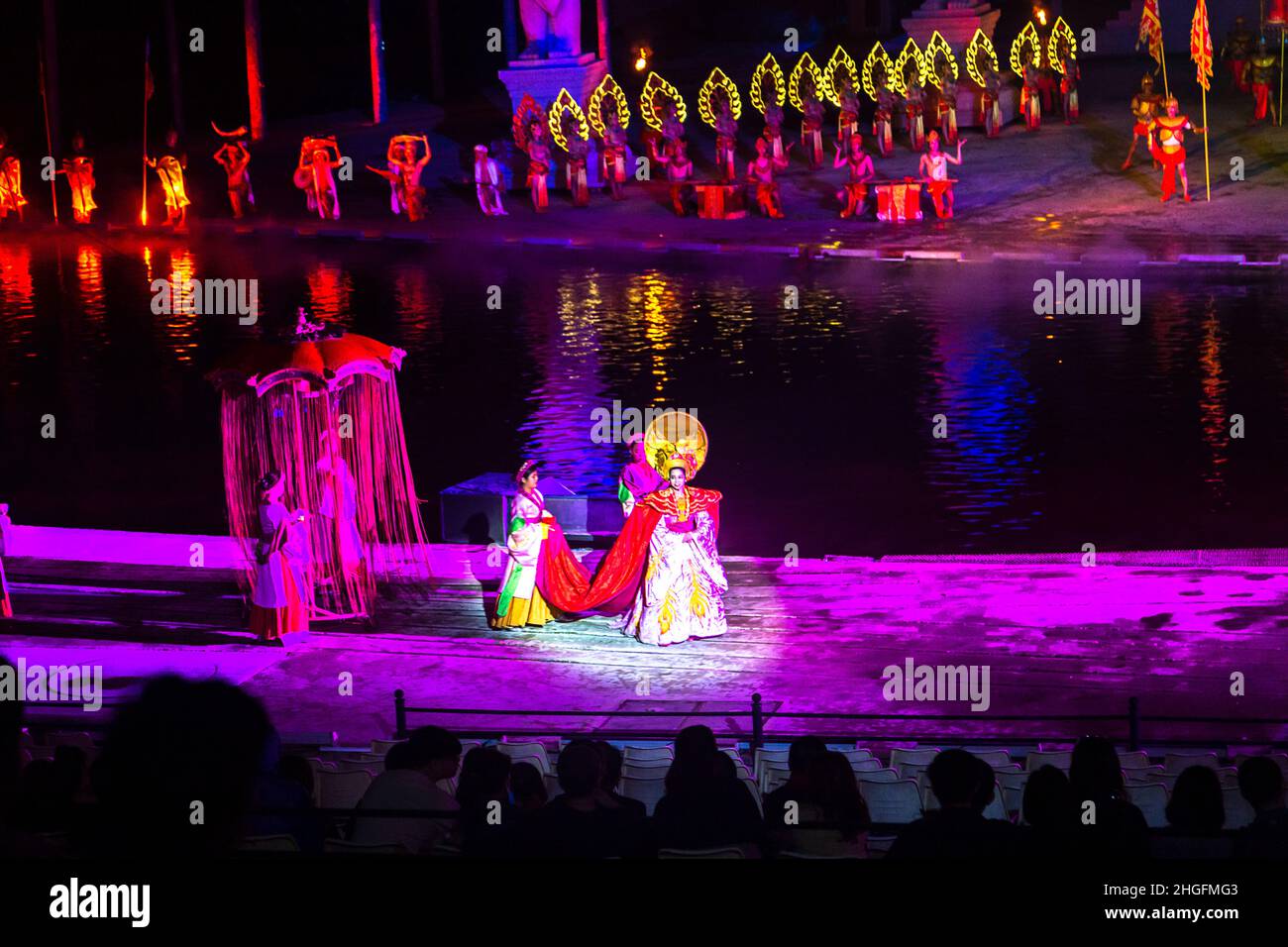 Hoi An Impressions water show with actors in front and more across the pond. Stock Photo