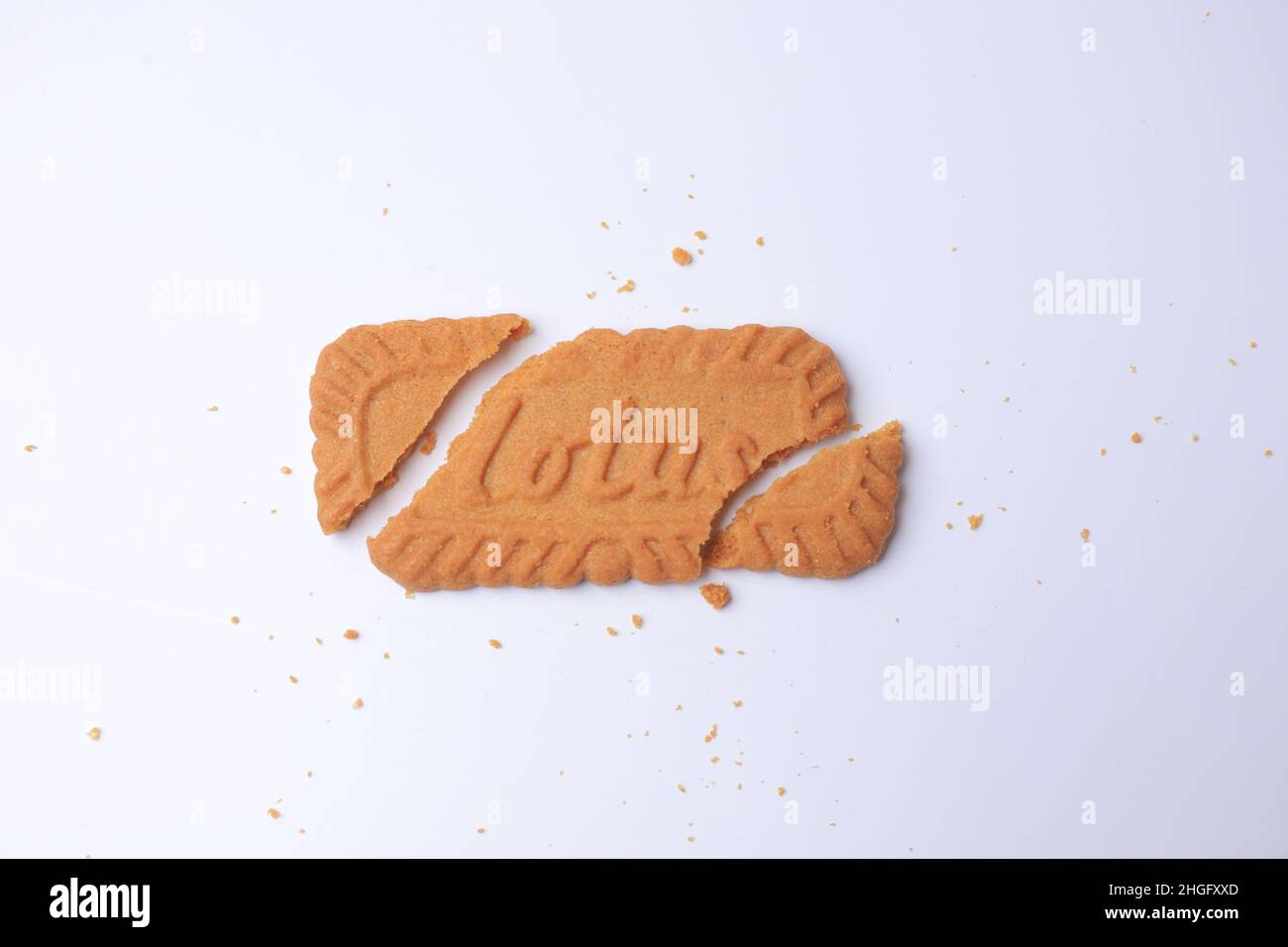 SIDOARJO - EAST JAVA, January 16, 2022: Lotus Biscoff is a caramelized biscuit, smooth and crunchy textures on white background. Copy space. Stock Photo