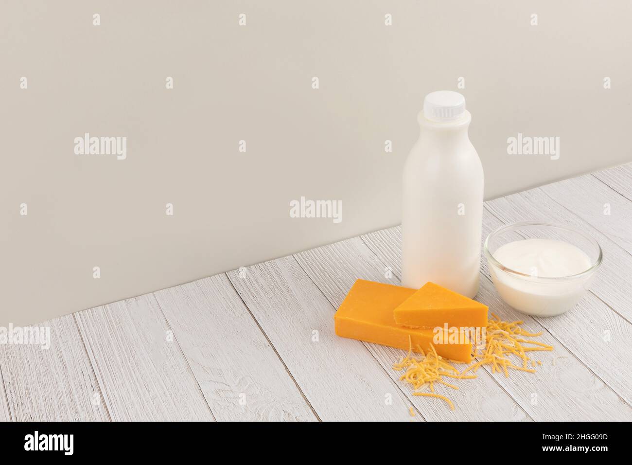 milk and cheddar cheese yogurt, ivory white wood background Stock Photo Alamy