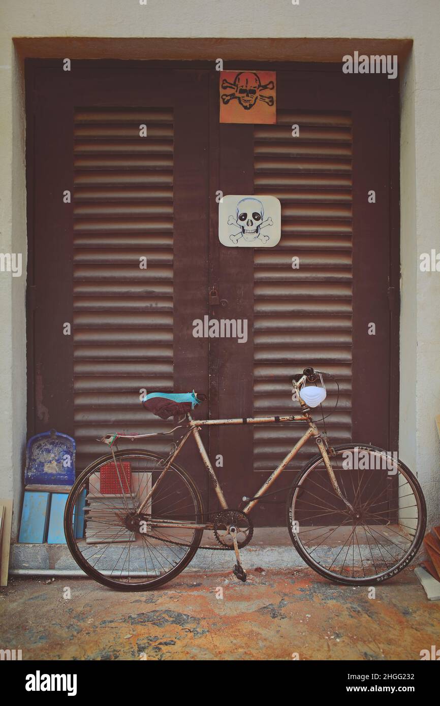 Bicycle parked at the door of the transformer station. Stock Photo