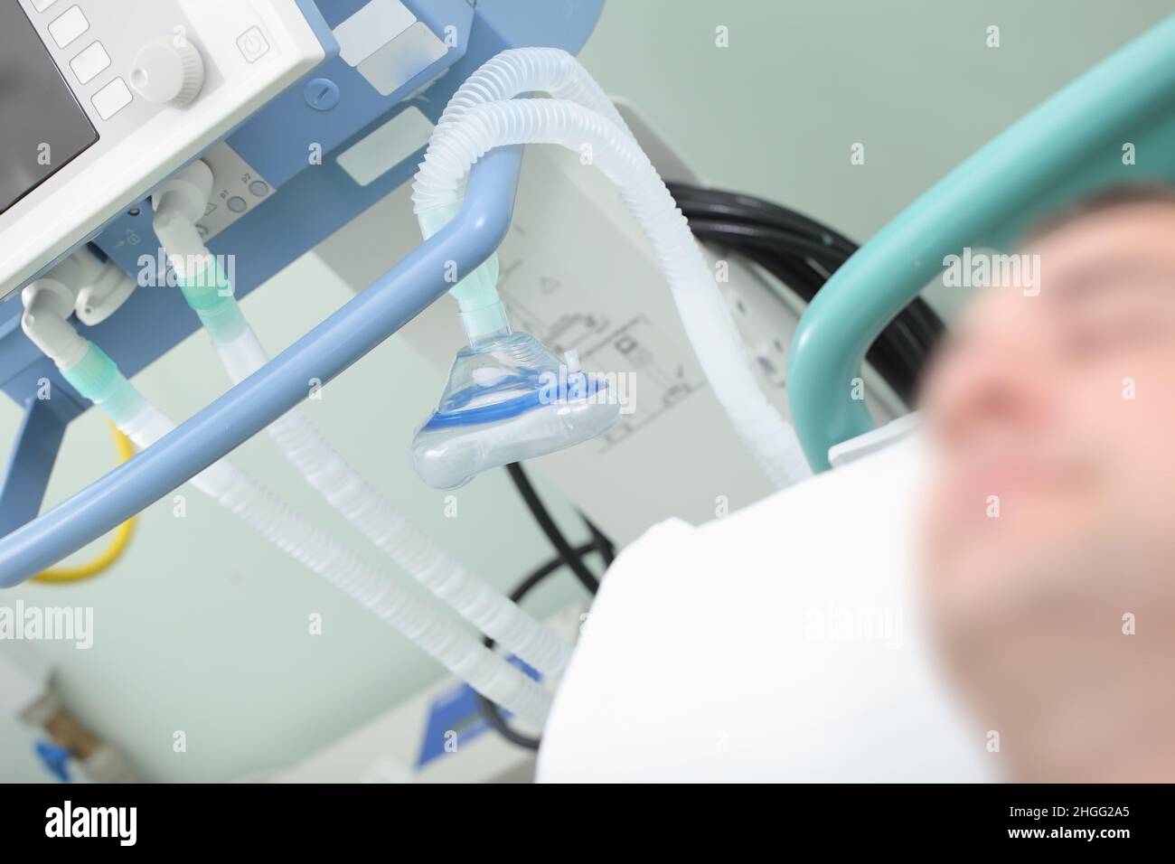 Respiratory equipment on the background of sleeping patient in the