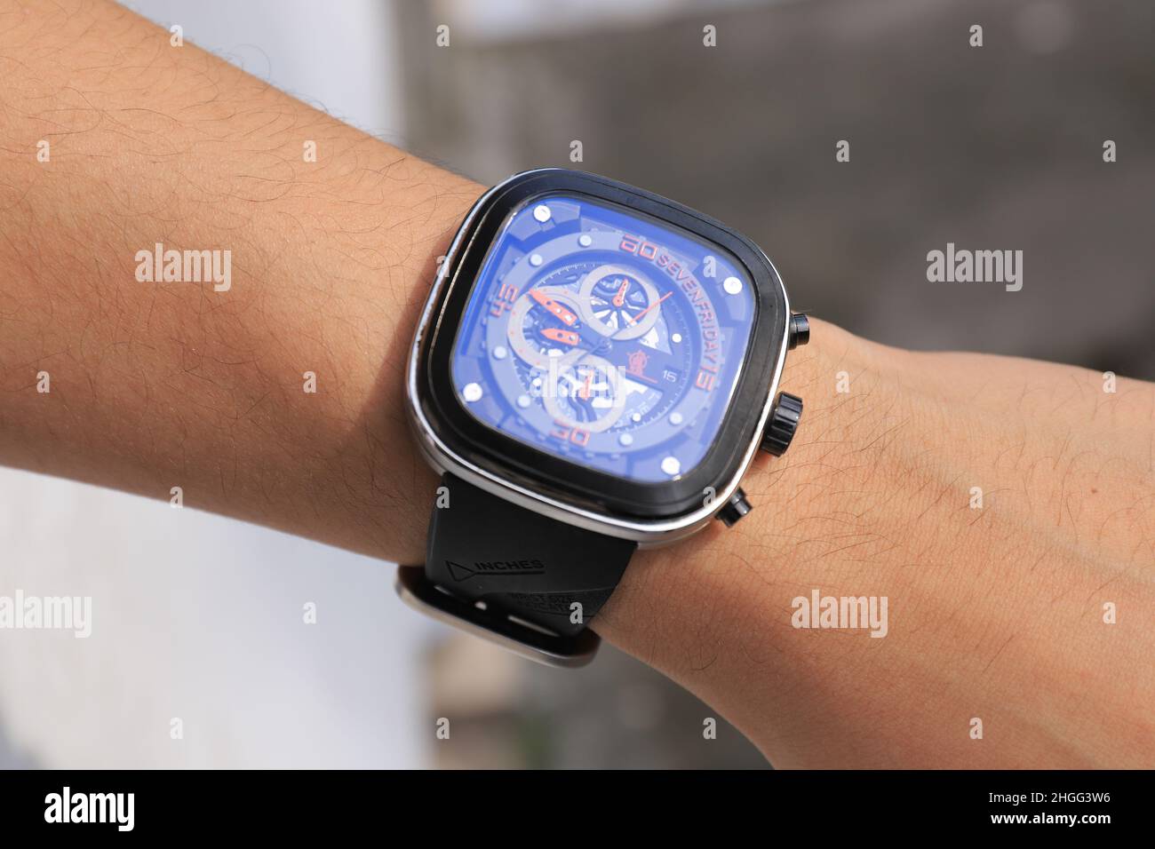 SURABAYA, EAST JAVA - January 15, 2021: selective focus, man hand with Sevenfriday brand watch on a blur background Stock Photo