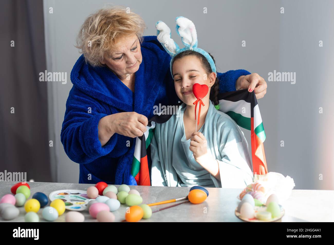 grandmother and granddaughter with uae flag for easter Stock Photo