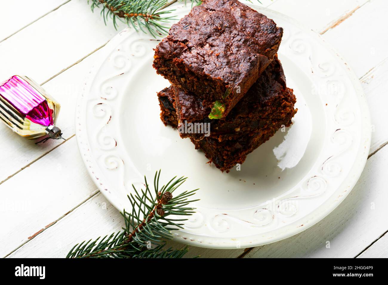 Panforte is a Christmas or New Year pastry made from a mixture of nuts, candied fruits, spices, honey. Stock Photo