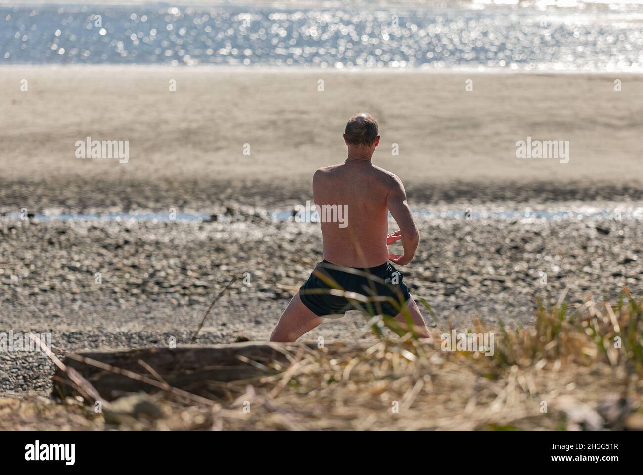 A man practicing traditional Tai Chi Chuan, Tai Ji and Qi gong in the park for healthy. Stock Photo