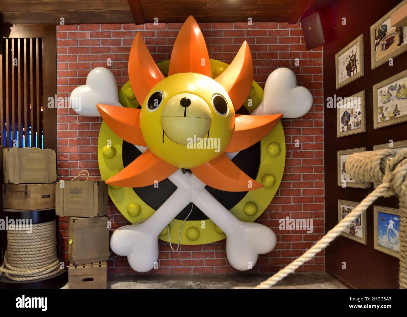 Thousand Sunny logo of One Piece mounted on wall Stock Photo