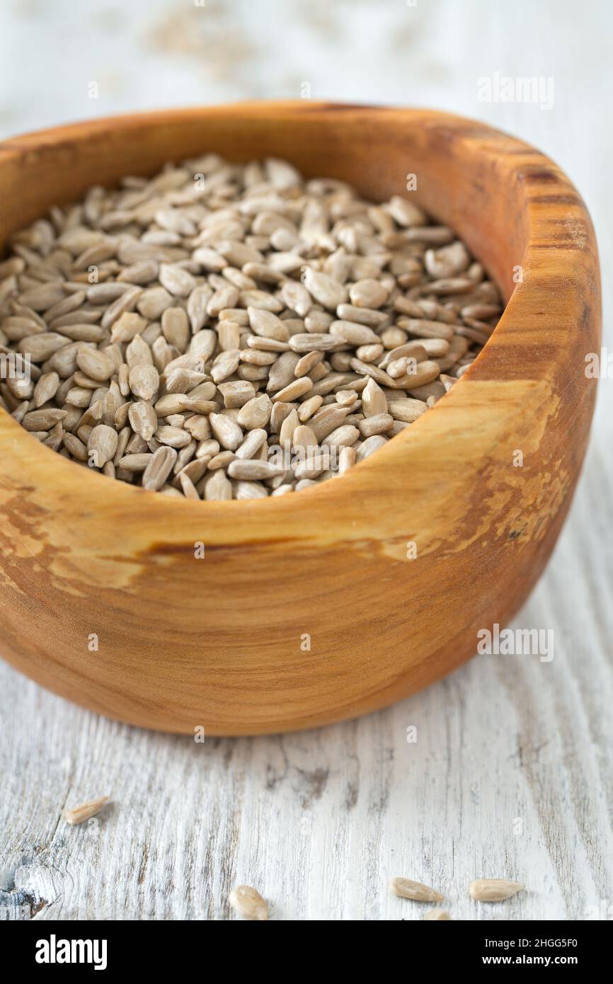 sunflower seeds in a wooden bowl Stock Photo