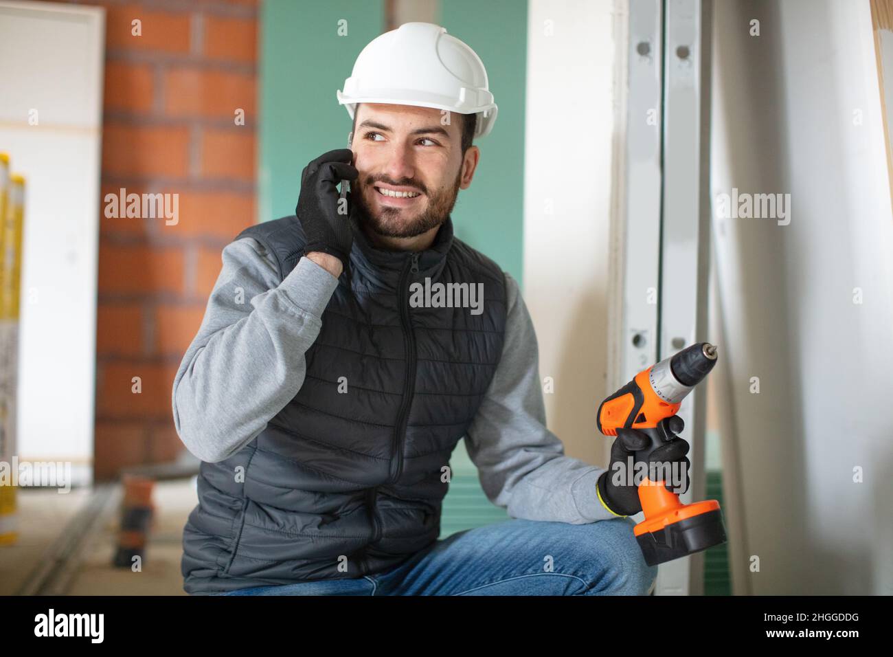 foreman making a call whilst on site Stock Photo