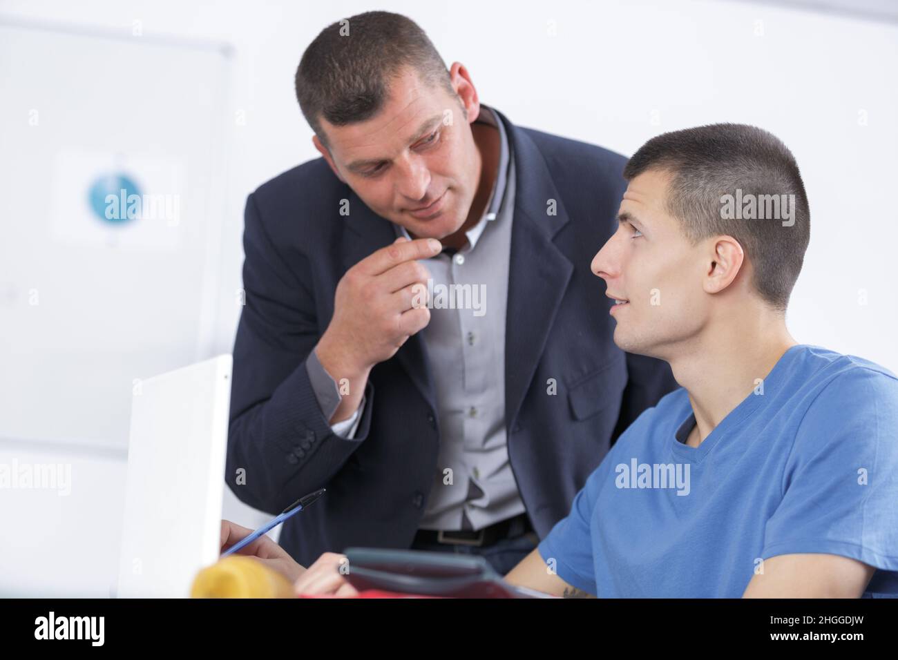 university student discussing project in classroom Stock Photo - Alamy