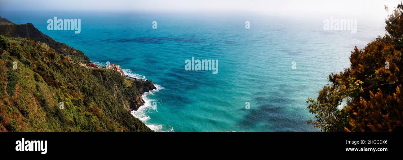 Coastal panorama with blue sea and a small town in Italy Stock Photo ...