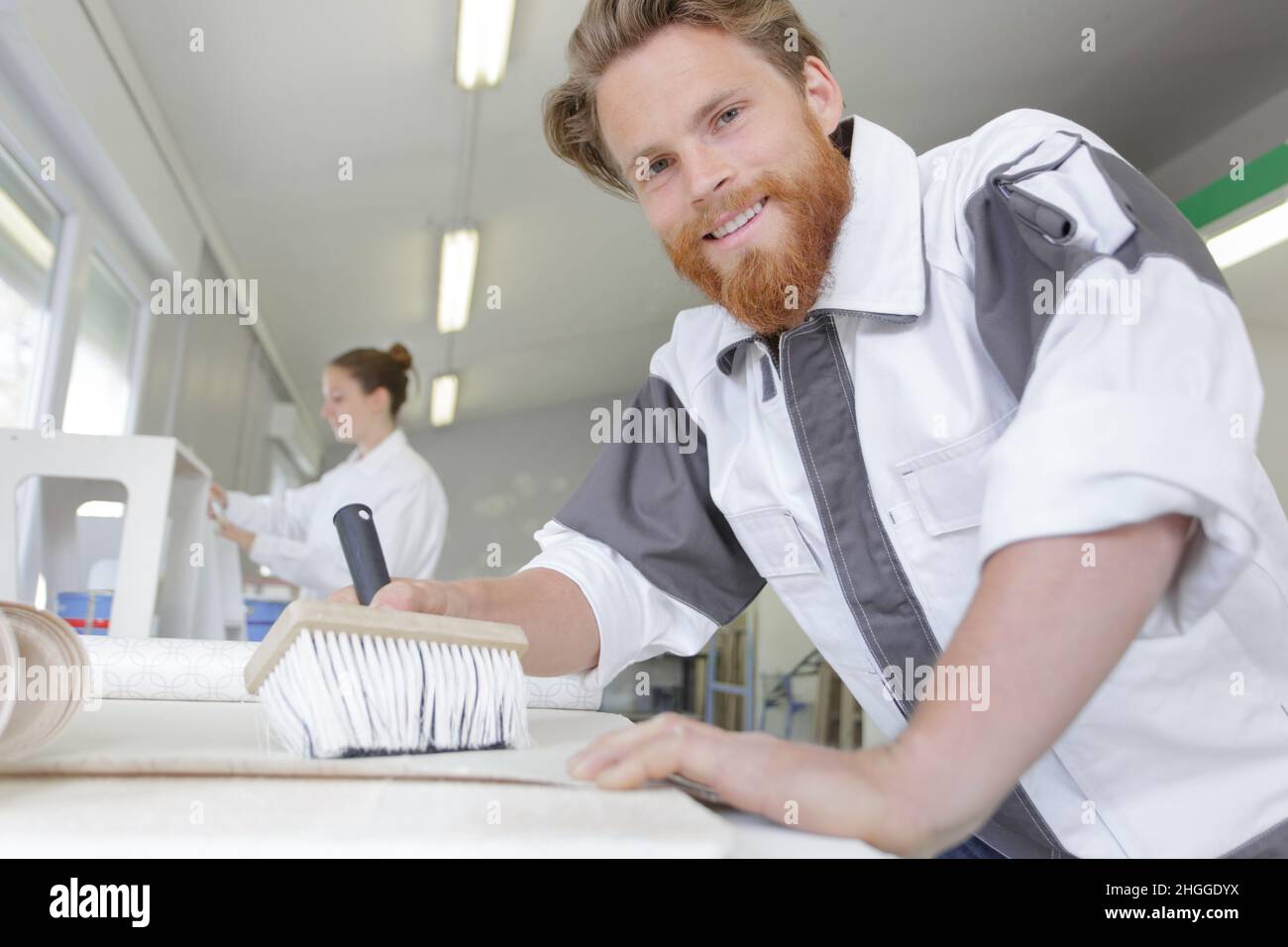 contractor worker preparing for wallpaper decoration Stock Photo