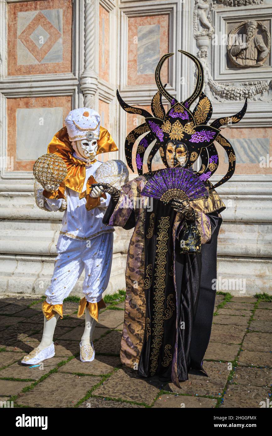 Participants in colourful arlecchino harlequin fortune teller costume and  mythical oriental outfit pose, Carnevale Di Venezia, Venice Carnival, Italy  Stock Photo - Alamy