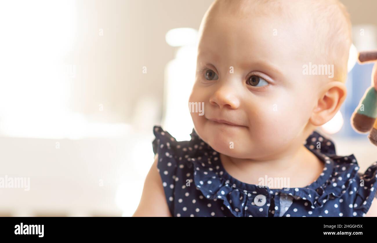 Portrait of little cute baby girl, light effect Stock Photo - Alamy