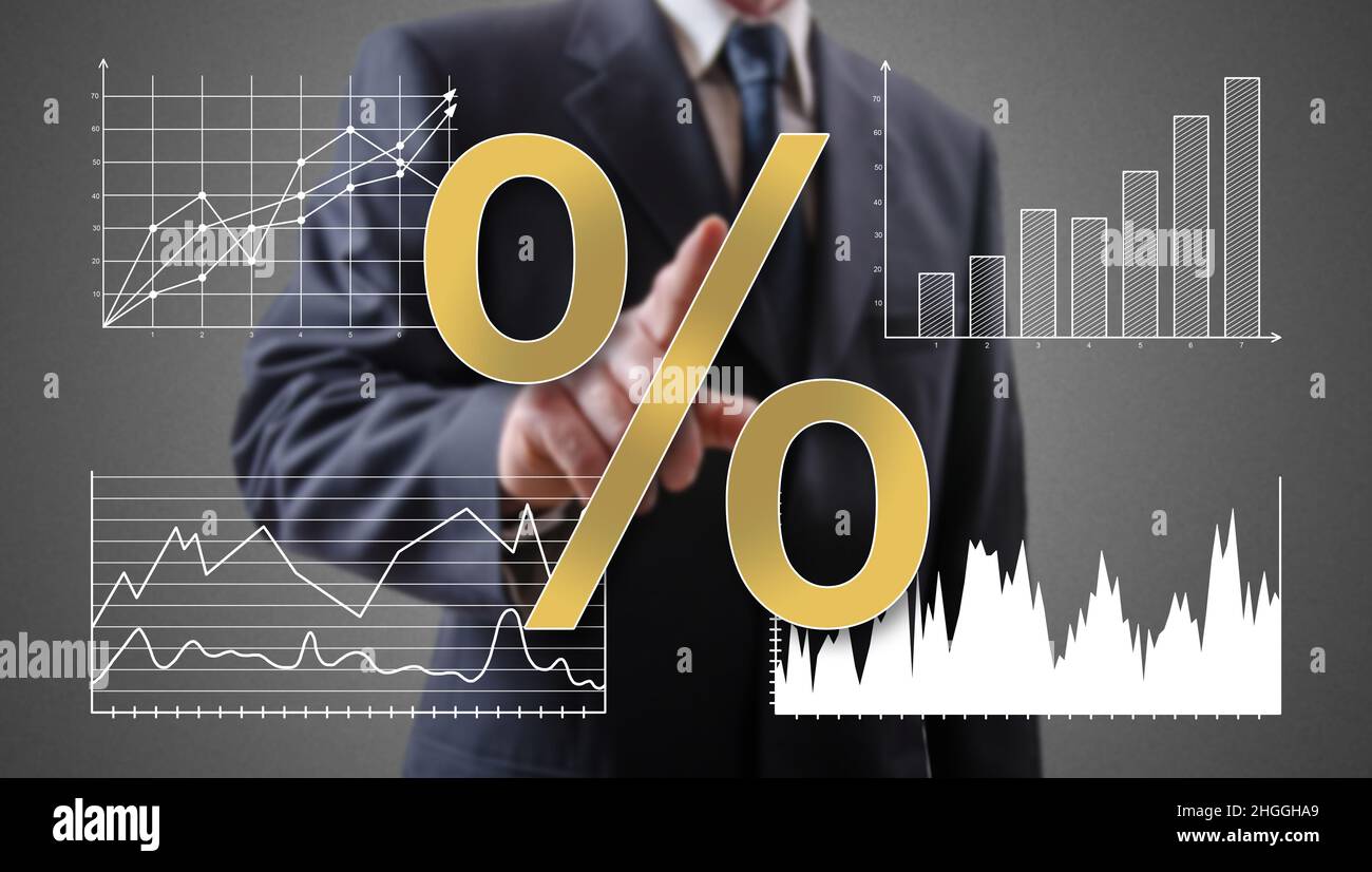 Interest rates concept shown by a businessman in background Stock Photo ...