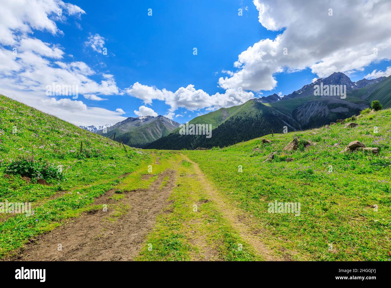 A walking path leads to distant mountains.beautiful natural scenery in Xiata Scenic Area,Xinjiang,China. Stock Photo
