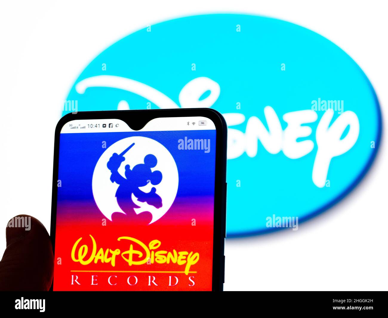 In this photo illustration, the Walt Disney Records logo is seen displayed  on a smartphone screen with the Disney logo in the background Stock Photo -  Alamy