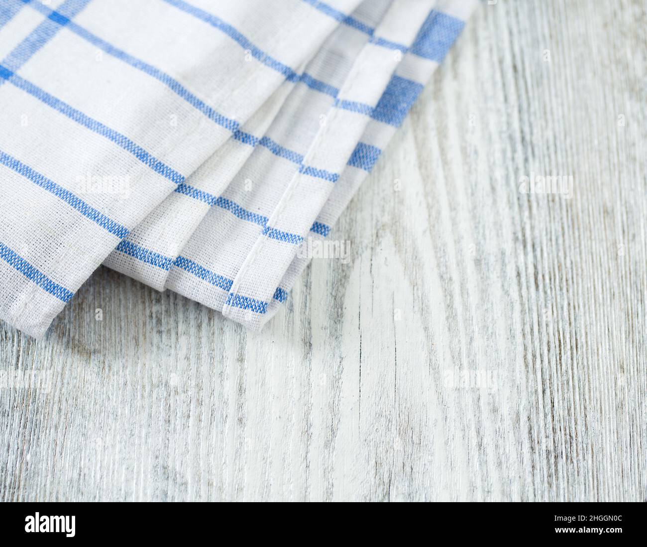 https://c8.alamy.com/comp/2HGGN0C/blue-kitchen-towel-on-white-background-2HGGN0C.jpg