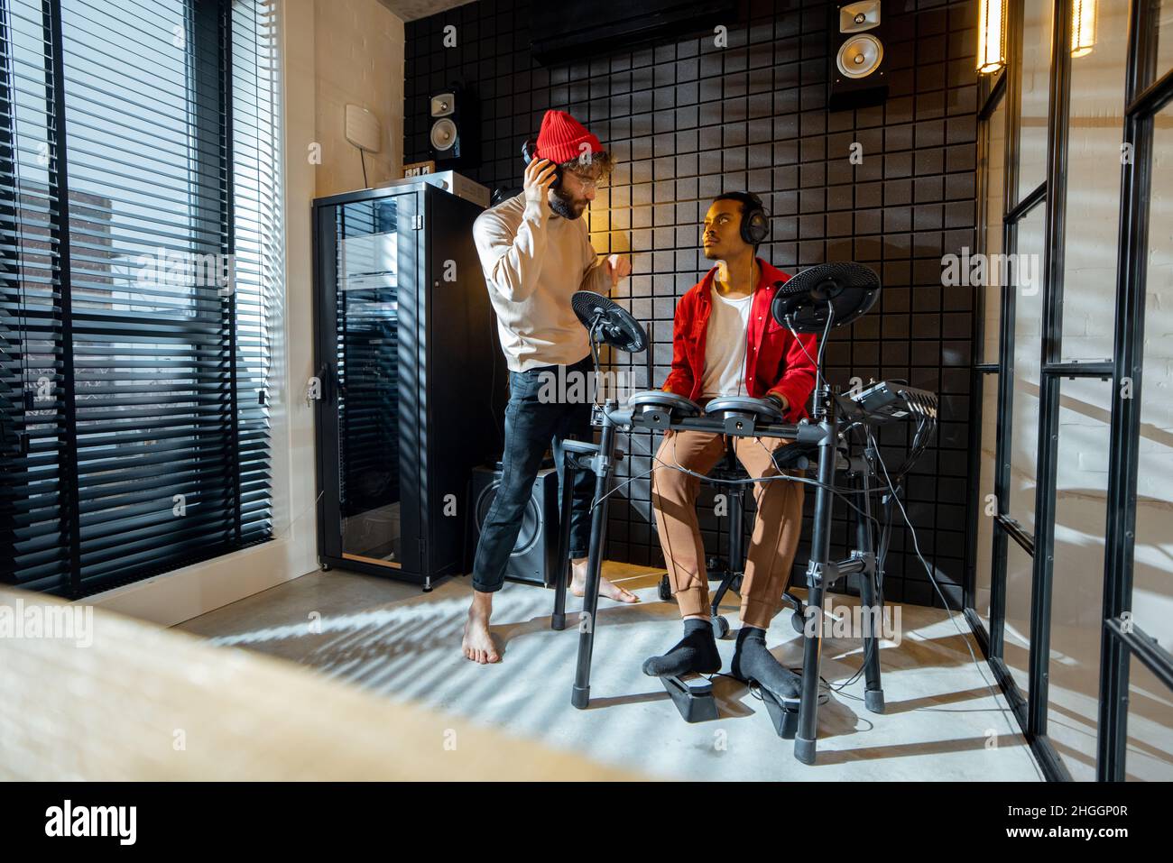 Men playing electric drums at home studio Stock Photo