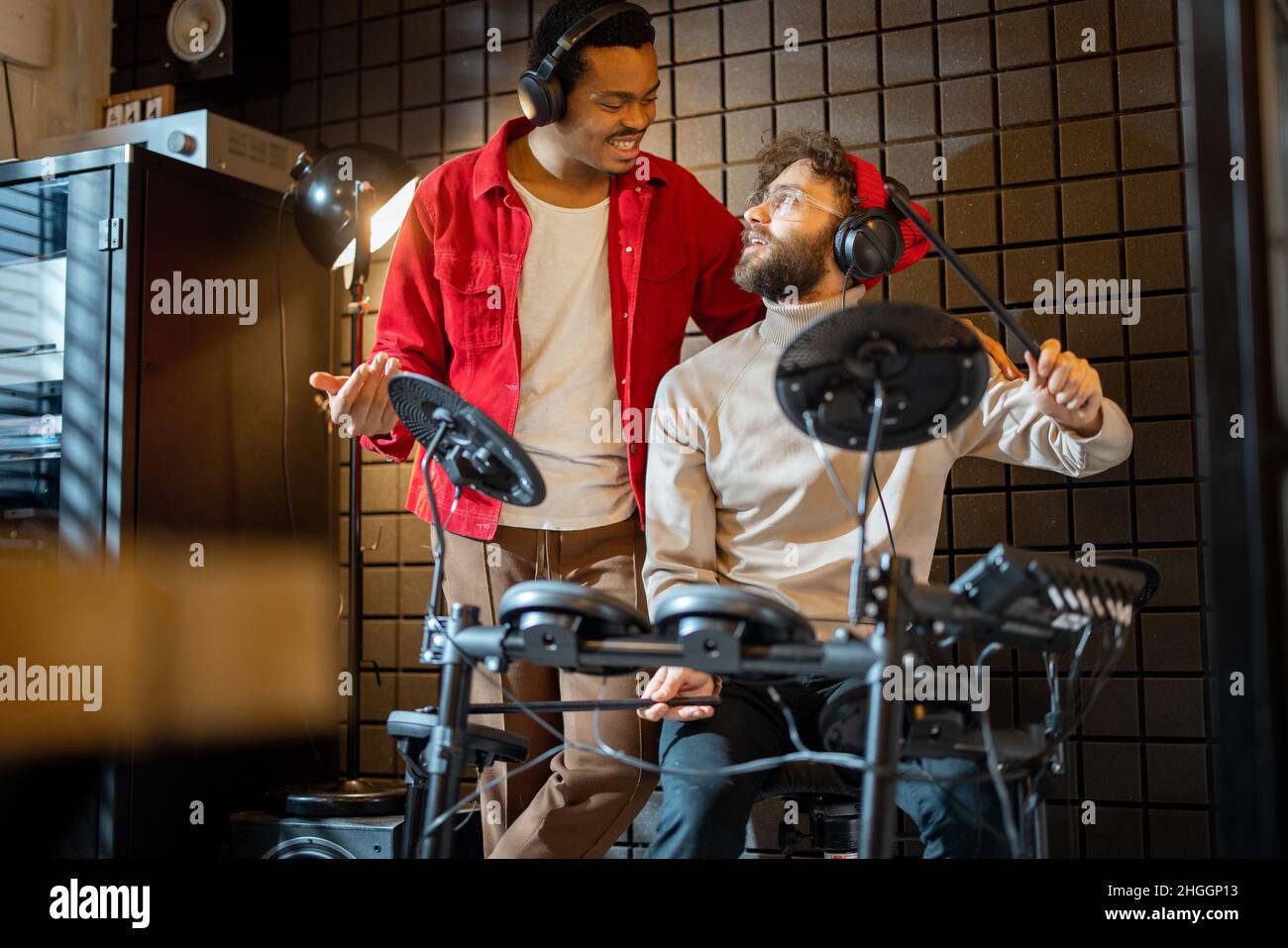 Men playing electric drums at home sstudio Stock Photo