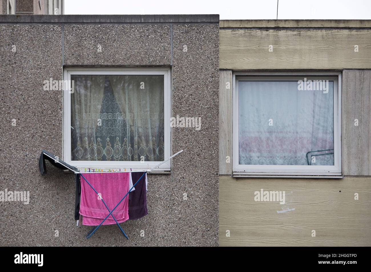clotheshorse at a window of the first floor of a depressing building block, Germany, Lower Saxony, Goettingen Stock Photo