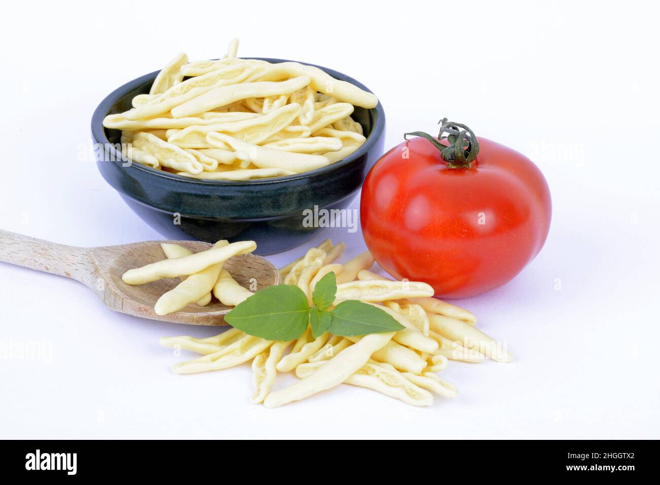 Italian pasta, fagiolini with fresh tomato and basil Stock Photo