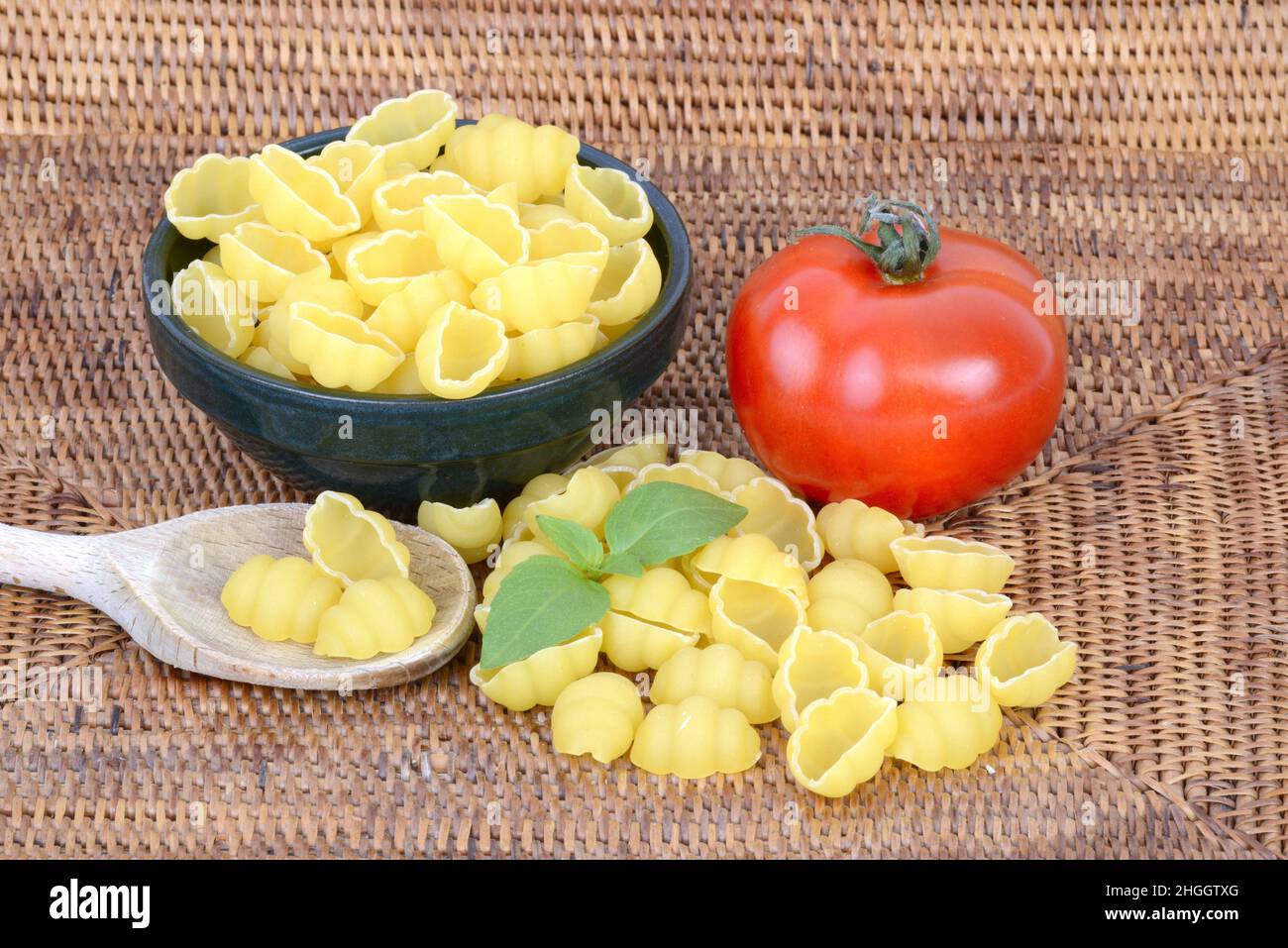 Italian pasta, conchiglioni with fresh tomato and basil Stock Photo