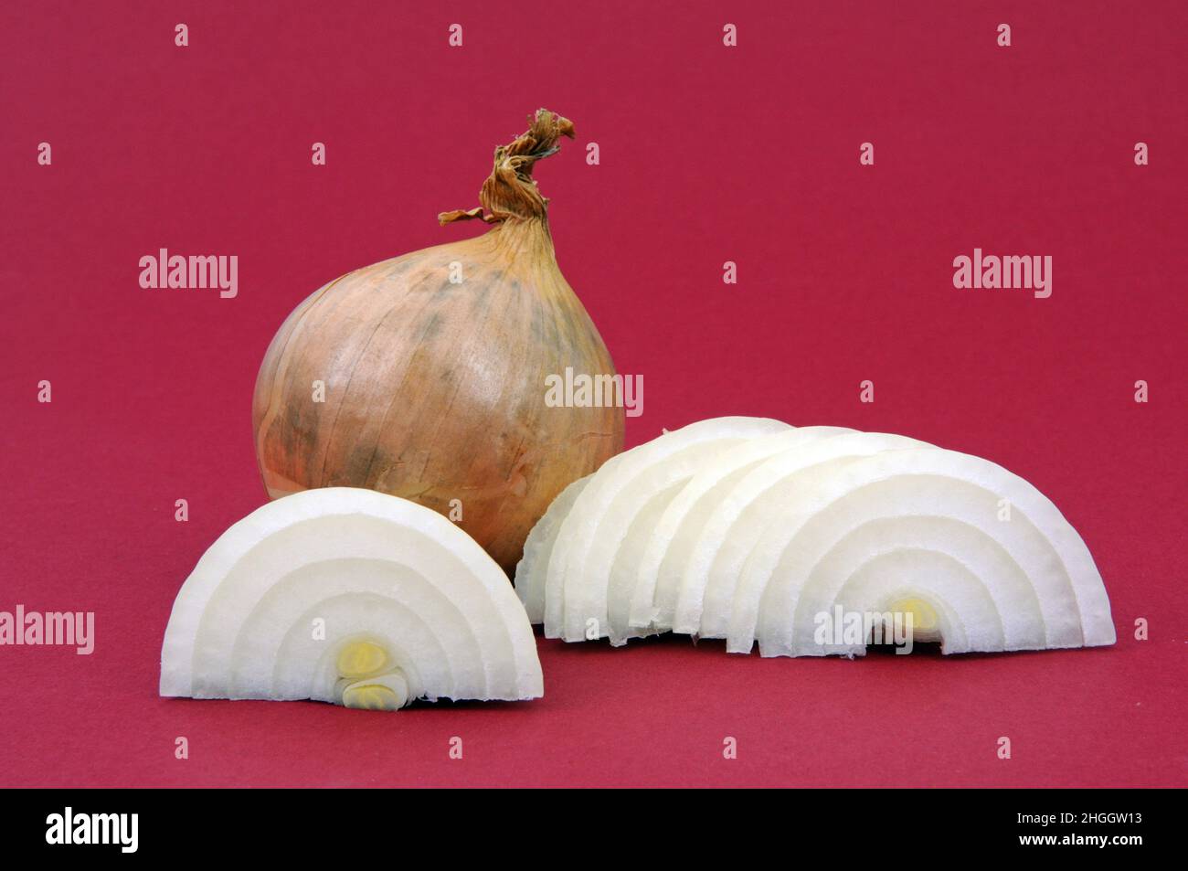 Garden onion, Bulb Onion, Common Onion (Allium cepa), Whole and sliced onion Stock Photo