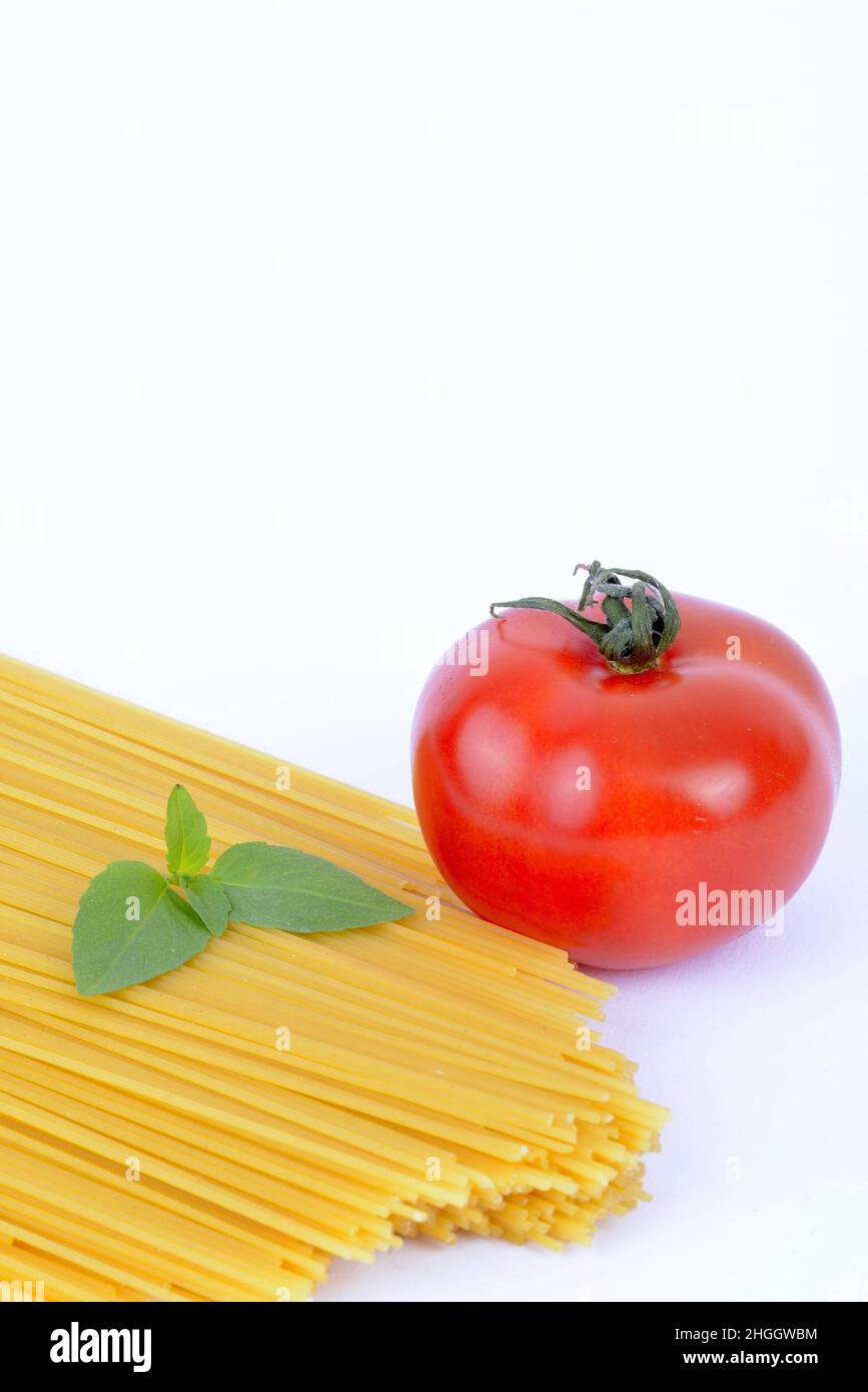 Italian pasta, macaroni with fresh tomato and basil Stock Photo