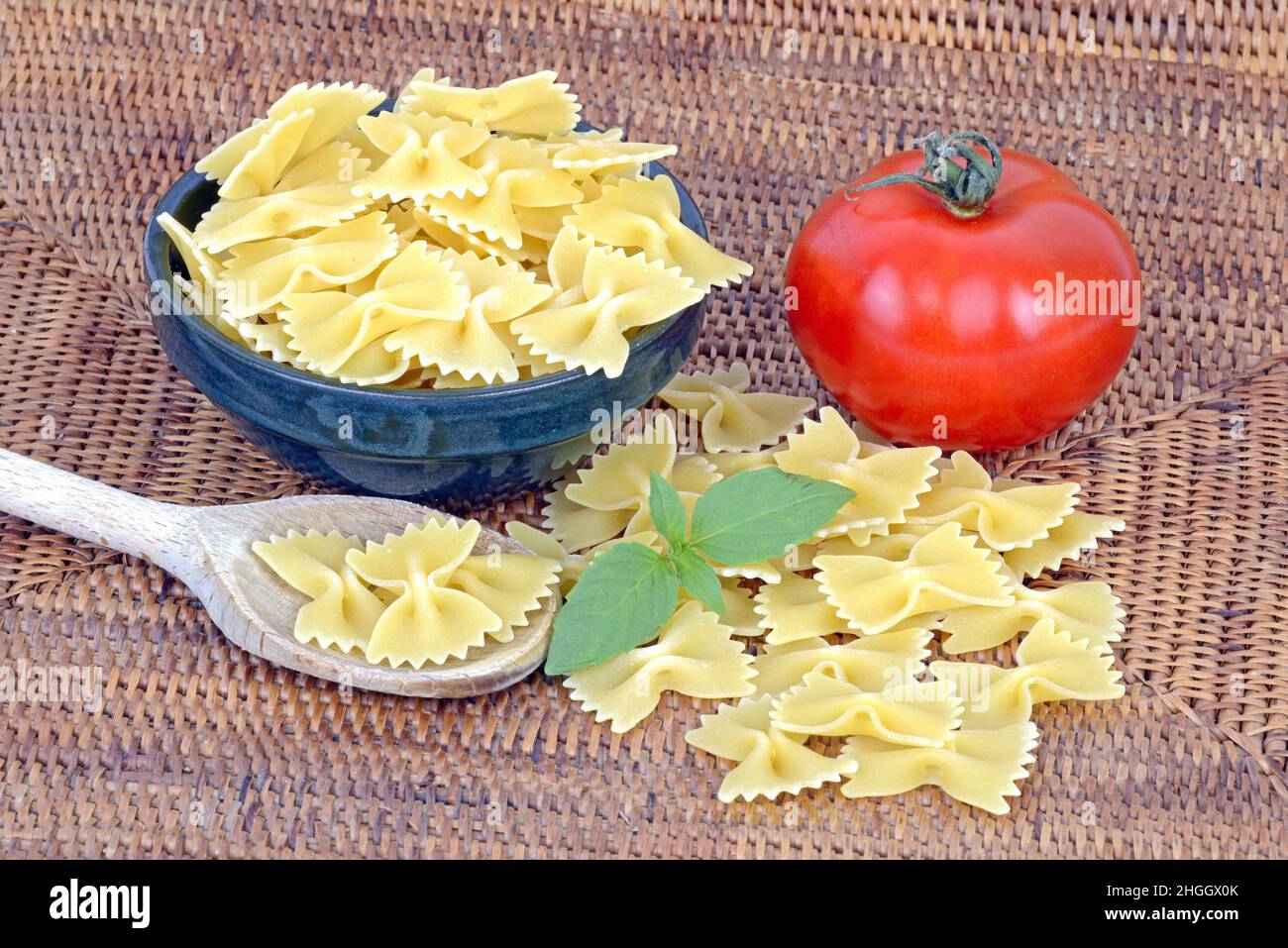 Italian pasta, farfalle with fresh tomato and basil Stock Photo
