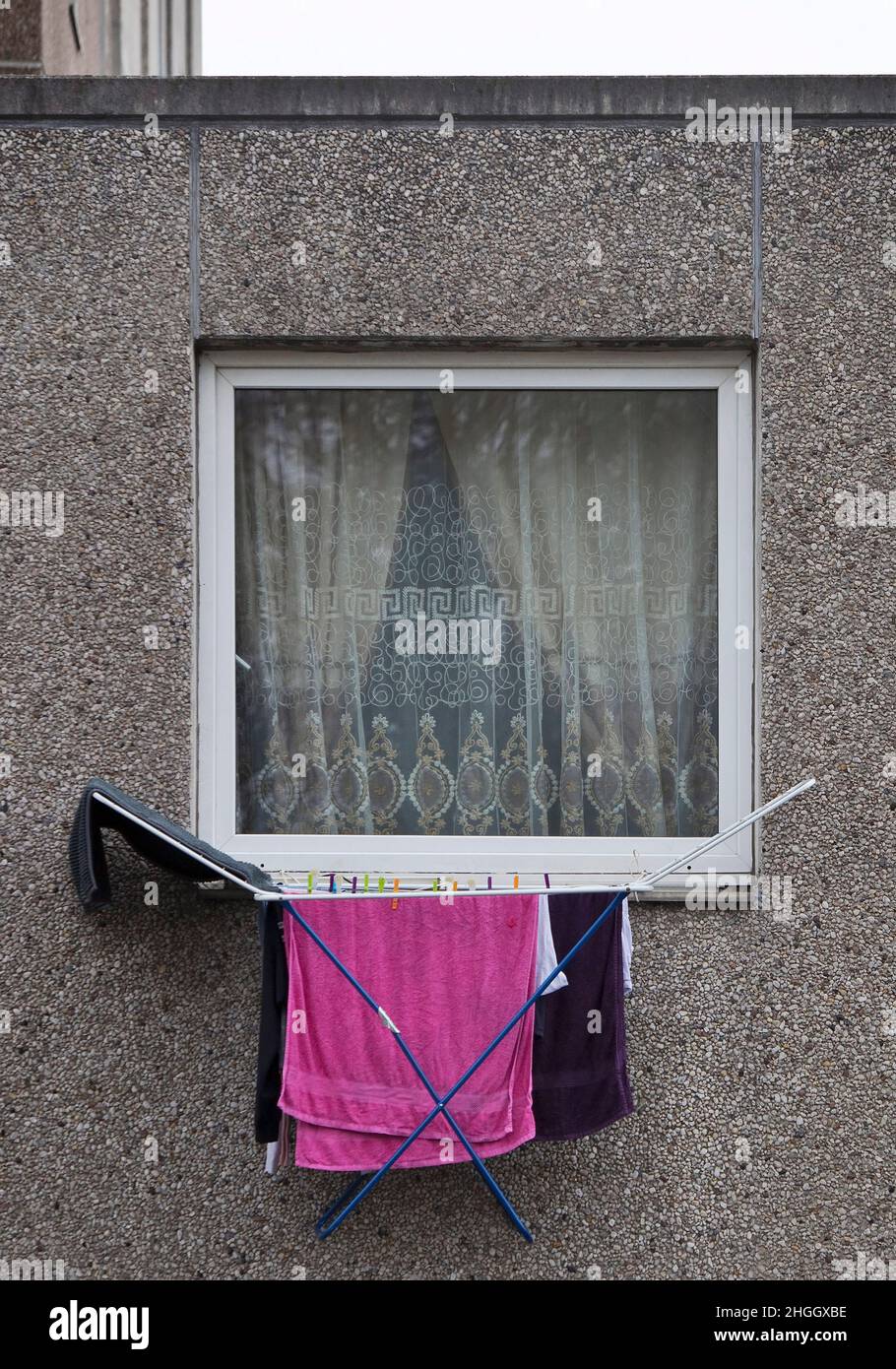 clotheshorse at a window of the first floor of a depressing building block, Germany, Lower Saxony, Goettingen Stock Photo