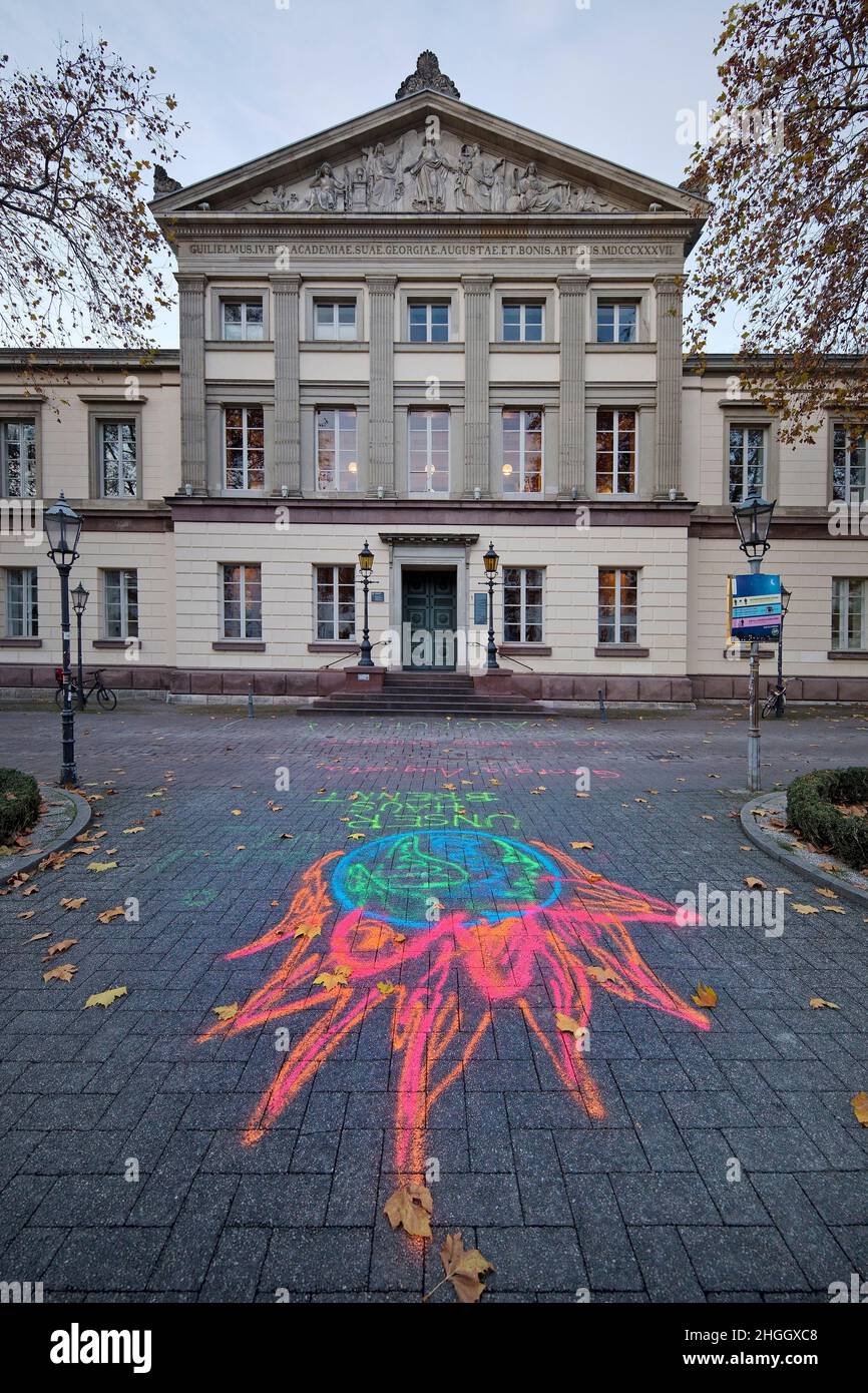 Our house is burning. Georgia Augusta, where is your voice? Climate emergency to proclaim! Painting on the paving of the Univerity Goettingen, Stock Photo