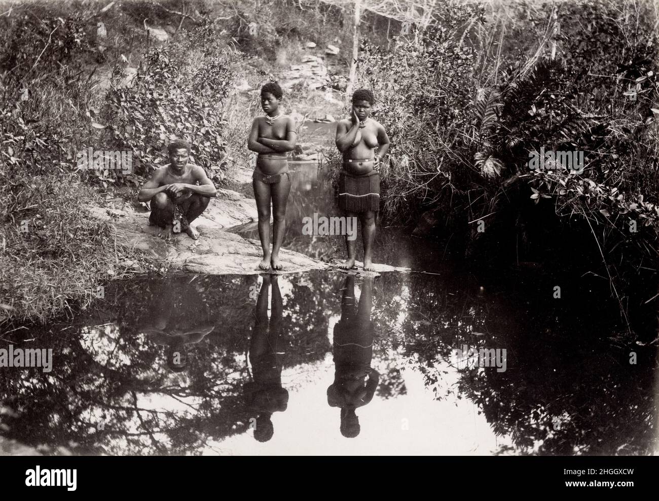 Late 19th century vintage photograph: Indigenous man and women at pond, Natal, South Africa Stock Photo