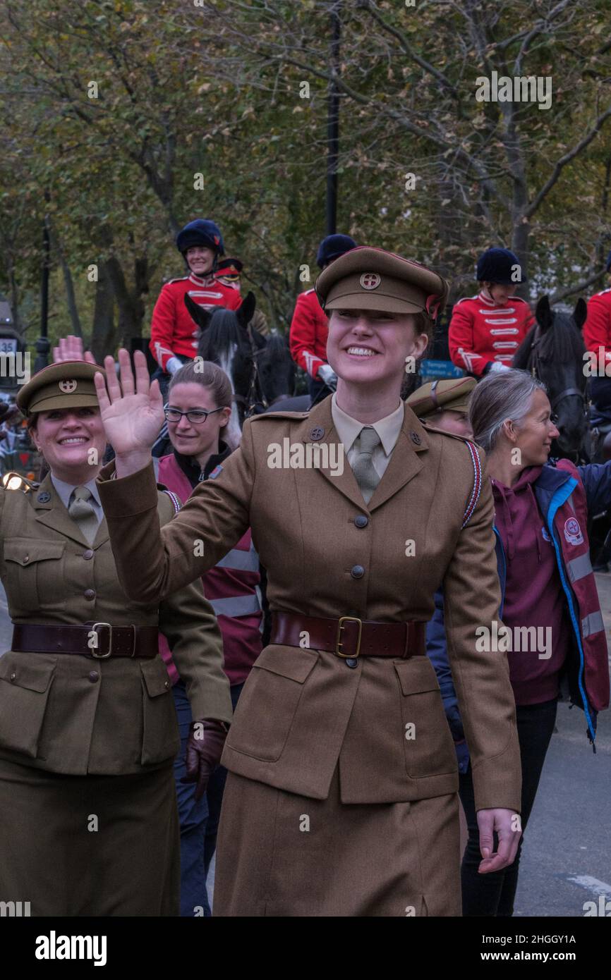 Women in military uniforms with The First Aid Nursing Yeomanry smile and wave at the Lord Mayor's Show 2021, Victoria Embankment, London, UK. Stock Photo