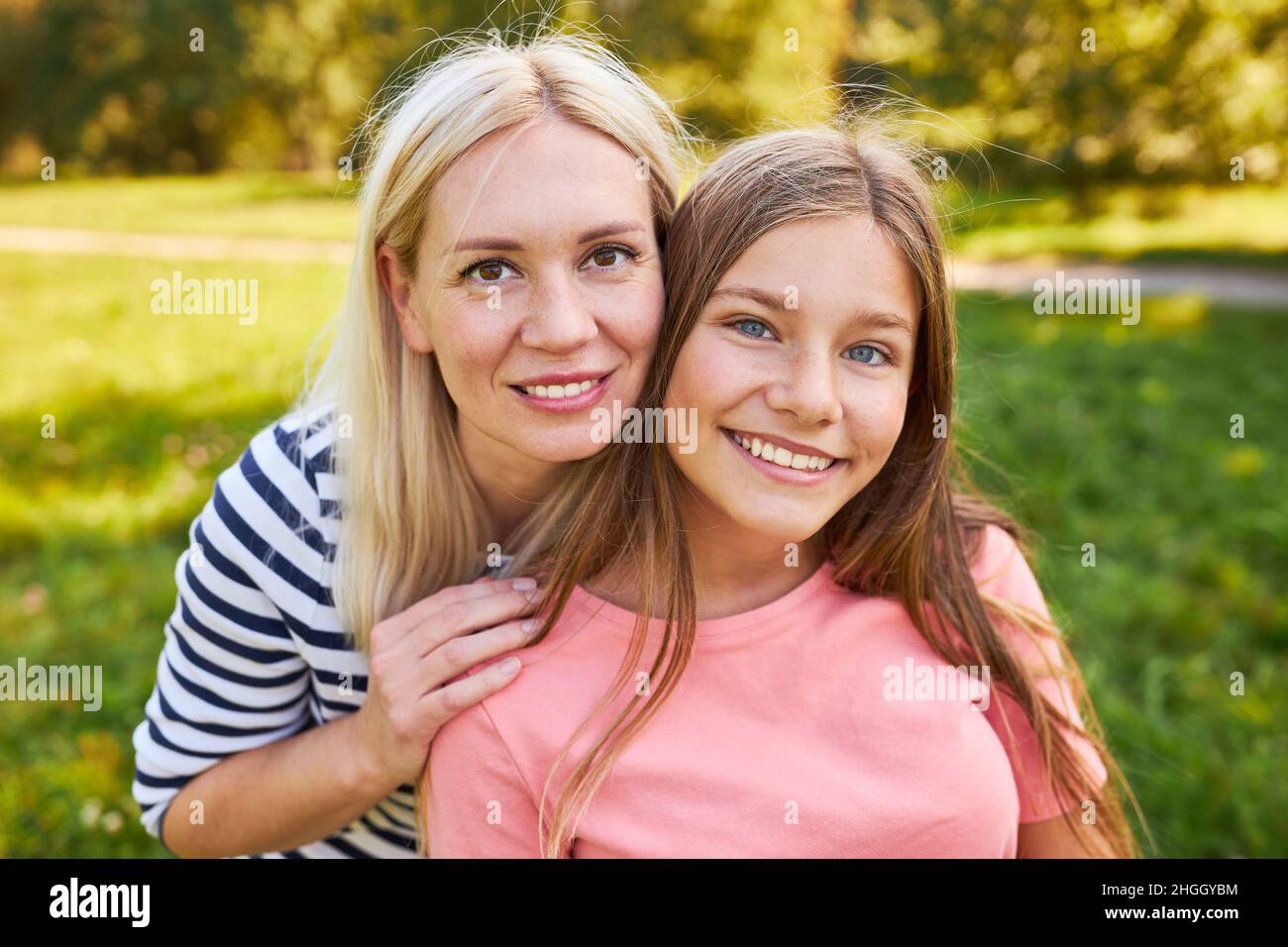 Single mother and daughter together in nature in summer Stock Photo