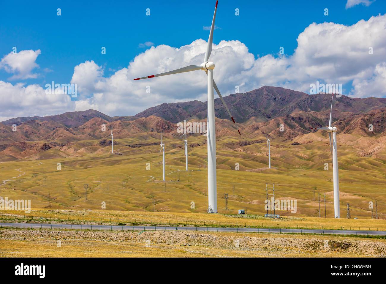 Wind power generation and mountain natural scenery in Xinjiang,China. Stock Photo