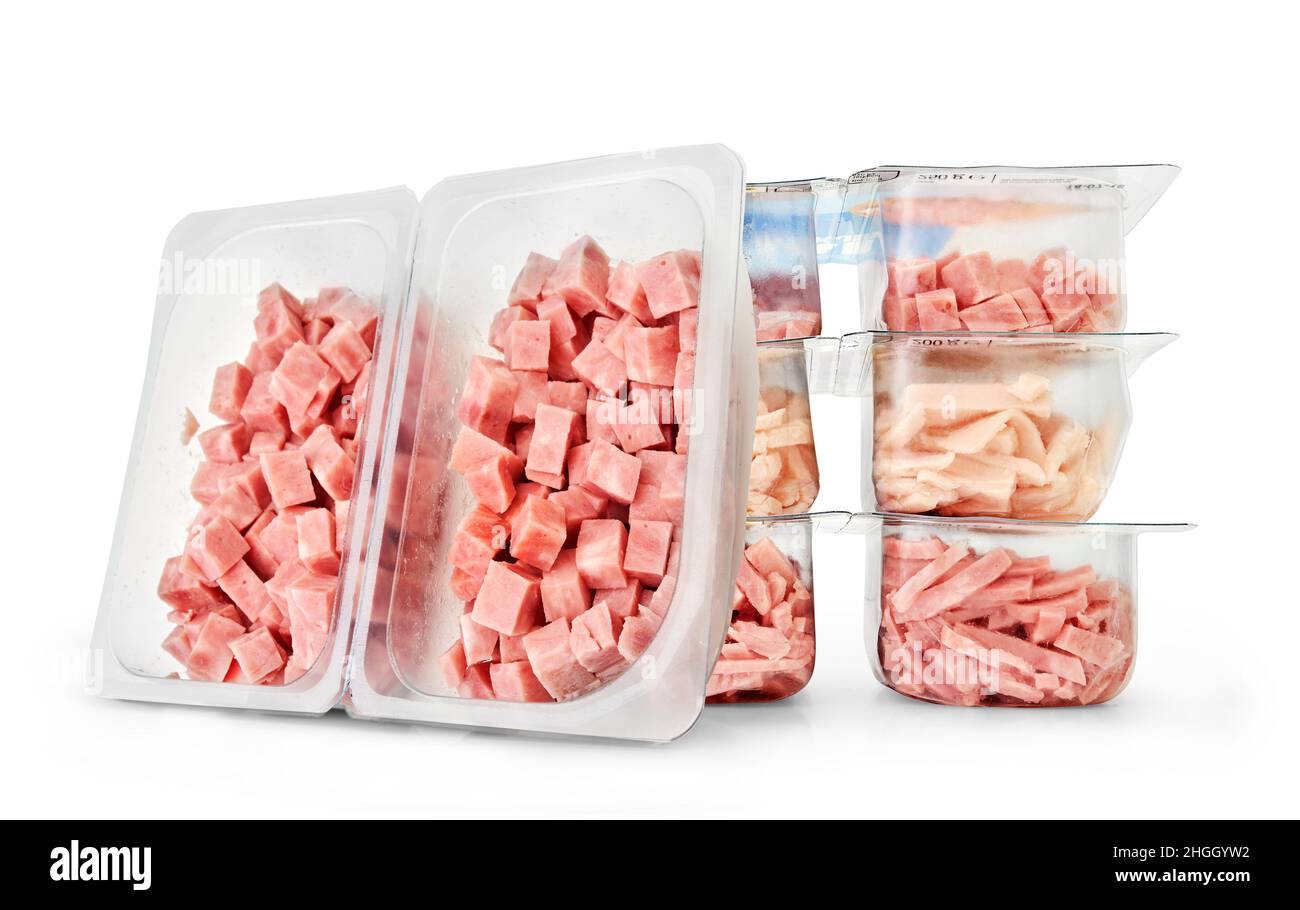 Packaged pieces of ham in a studio setting, isolated on white Stock