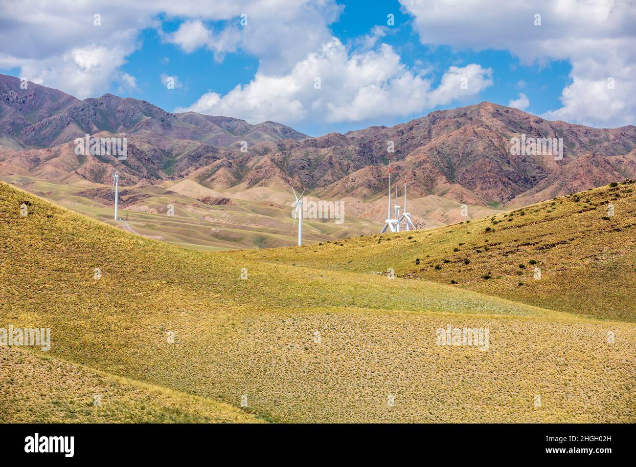 Wind power generation and mountain natural scenery in Xinjiang,China. Stock Photo