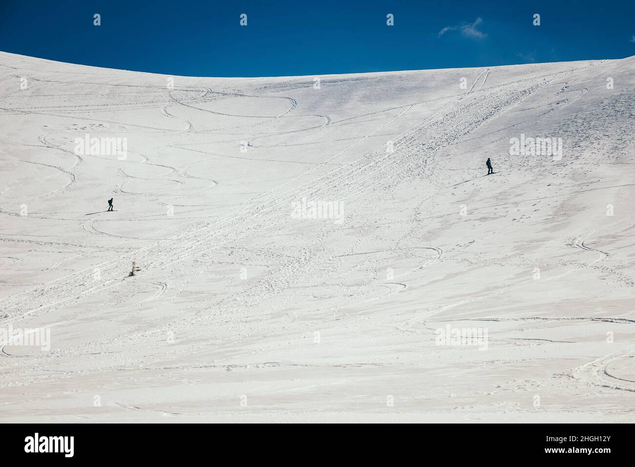 Snow in the mountains, skiers spring and winter Stock Photo
