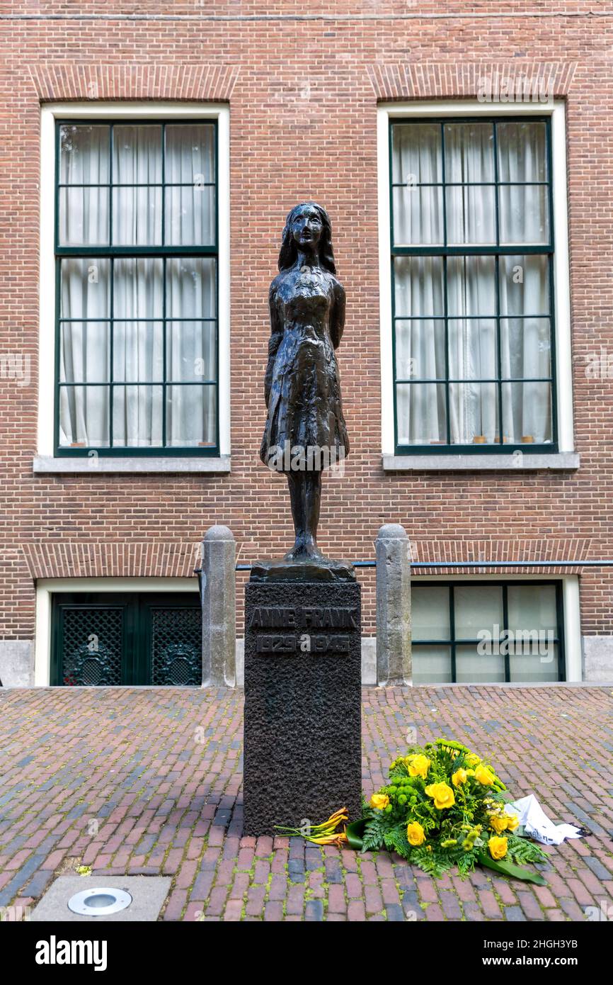 Amsterdam, Netherlands - 7 July 2014: Statue of Anne Frank by Mari Andreissen. A 15 year old Holocaust victim, famous for her diary, who died in a con Stock Photo