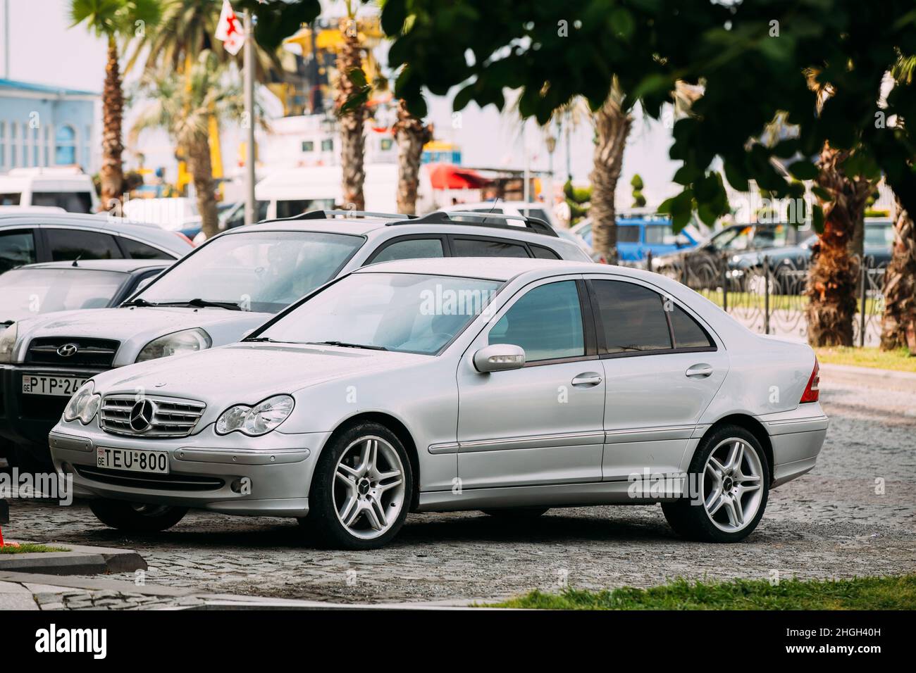 Mercedes-Benz C-Class (W203) Car Parked In street on Sunny Summer Day. W203 is an automobile which was produced by German manufacturer Mercedes-Benz Stock Photo