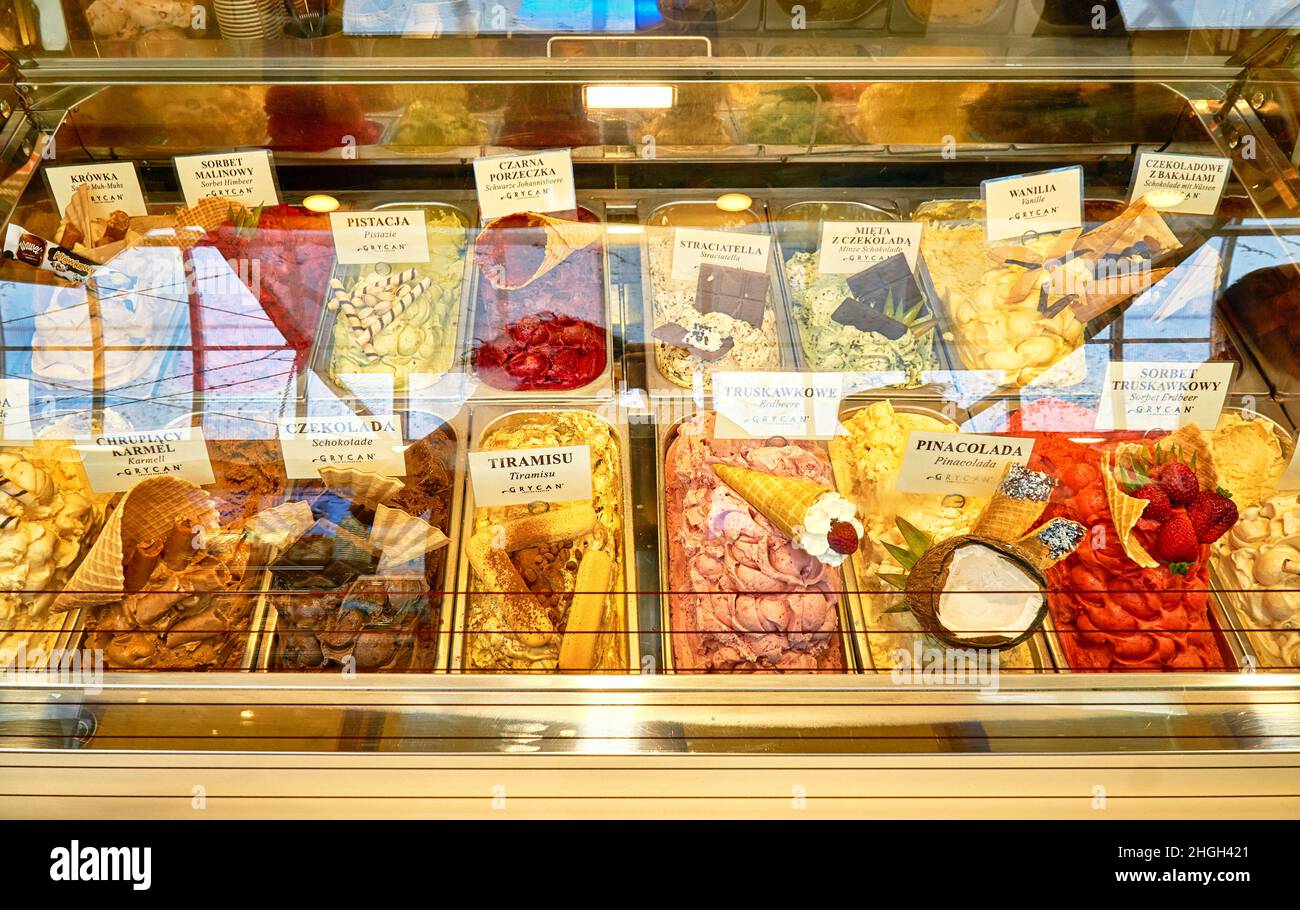 An ice cream display with different types of ice cream and names in Polish. Stock Photo