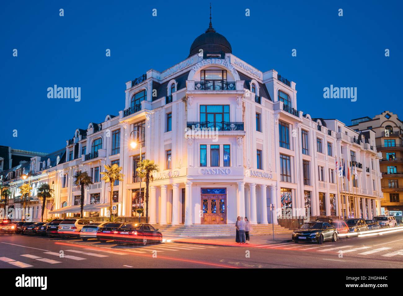 Batumi, Adjara, Georgia. Evening View Of Hotel And Casino President Plaza Located Next To Statue Of Medea Close To Piazza. Stock Photo