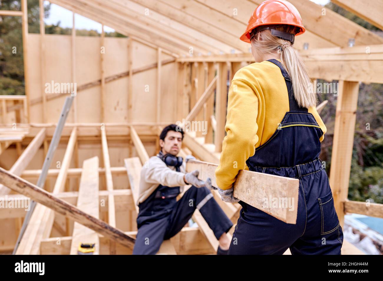 Two Specialists Measuring Matching The Size Of Wooden Beam During