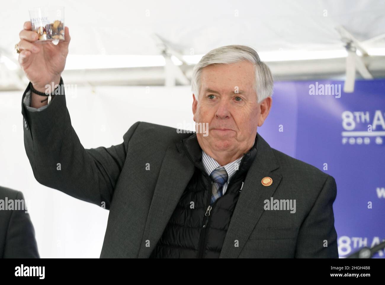 Hazelwood, United States. 21st Jan, 2022. Missouri Governor Mike Parson raises a cup of nuts and raisins before tasting during a ceremonial “first tasting” while officially opening 8th Avenue Food & Provisions, Inc. manufacturing plant in Hazelwood, Missouri on Thursday, January 20, 2022. 8th Avenue is relocating its fruit and nut manufacturing plant from Burnaby, British Columbia, Canada, to north St. Louis County and will bring more than 300 new jobs to the region. Photo by Bill Greenblatt/UPI Credit: UPI/Alamy Live News Stock Photo