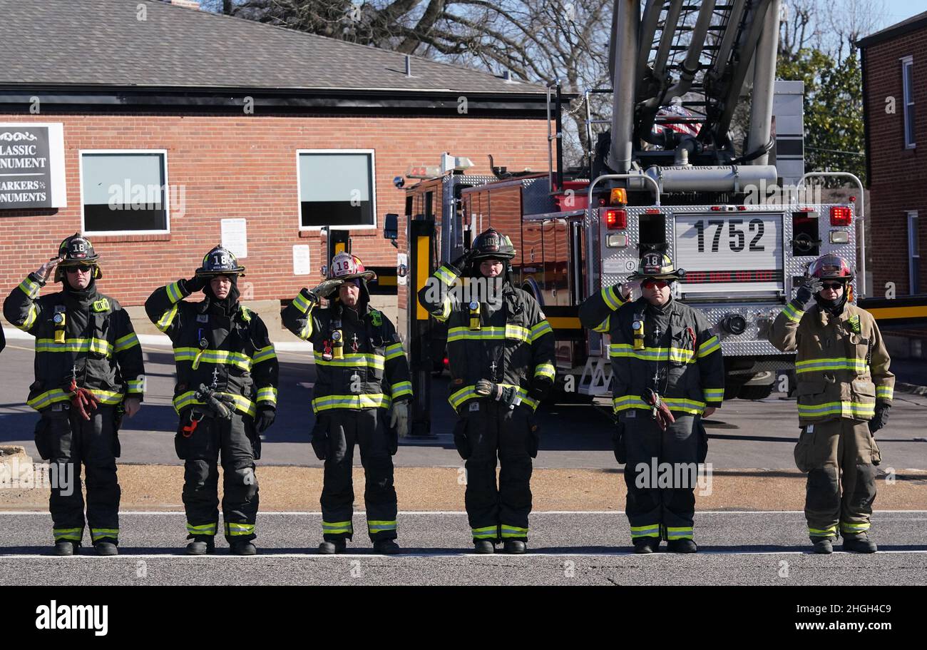 St. Louis, United States. 21st Jan, 2022. County firefighters salute as the caisson containing the remains of St. Louis firefighter Ben Polson passes by enroute to Resurrection Cemetery in St. Louis on Thursday, January 20, 2022. Polson, the first St. Louis firefighter to die in a fire in twenty years, died while battling a vacant house fire on January 13, 2022. Photo by Bill Greenblatt/UPI Credit: UPI/Alamy Live News Stock Photo