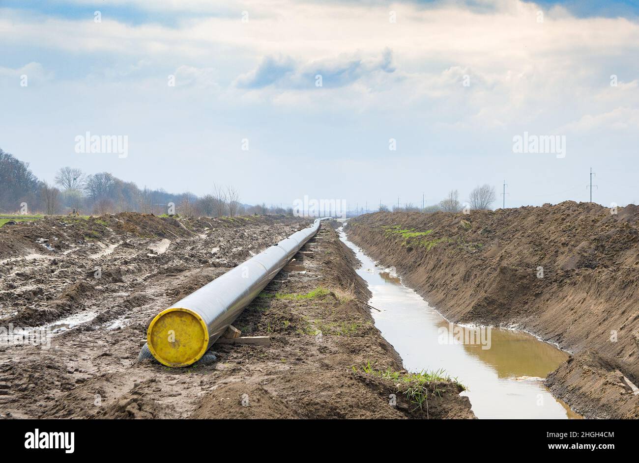 Natural gas pipeline construction work. A dug trench in the ground for